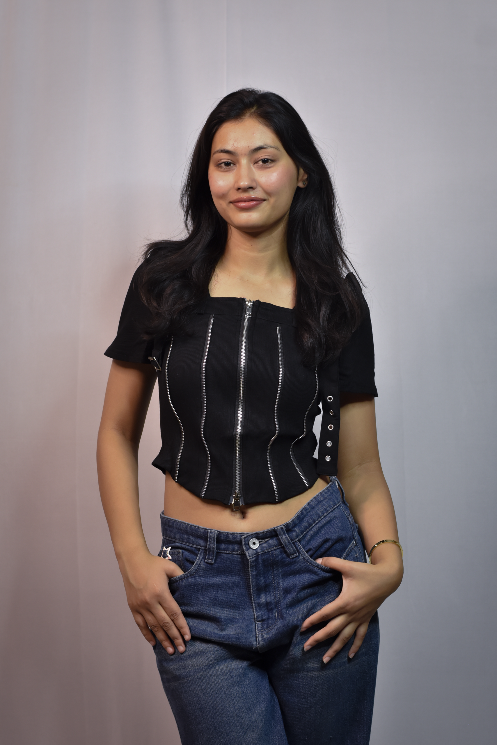 black corset style top with multiple vertical zippers