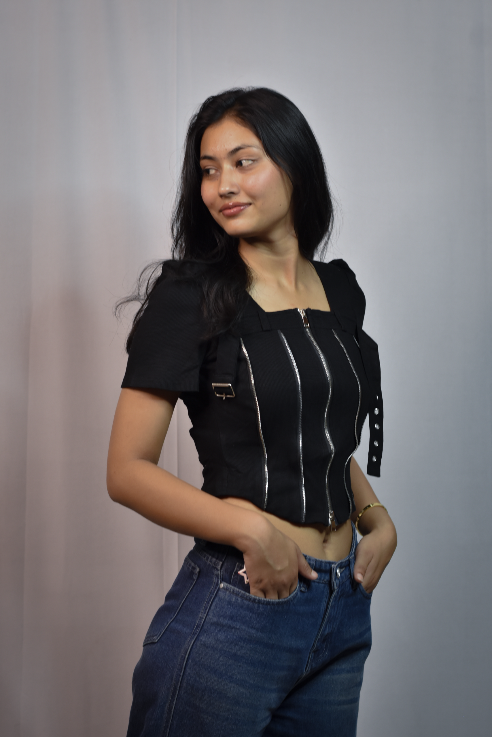 black corset style top with multiple vertical zippers